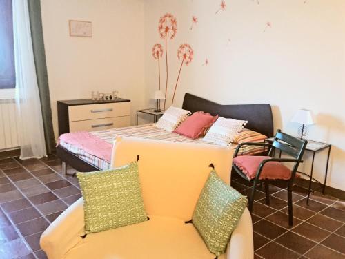 a living room with a bed and a couch at The Best View San Gimignano Apartments in San Gimignano