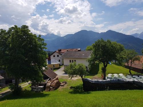 a view of a house with mountains in the background at Stoffenhof in Oberdrauburg