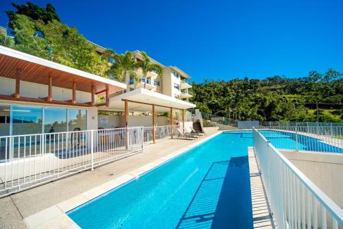 an image of a swimming pool at a house at Airlie Summit Apartments in Airlie Beach