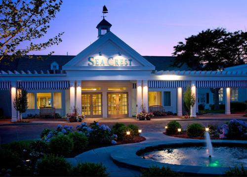 a large building with a fountain in front of it at Sea Crest Beach Hotel in Falmouth