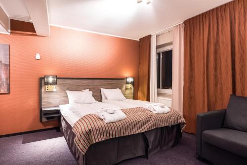 Säng eller sängar i ett rum på Clarion Collection Hotel Slottsparken