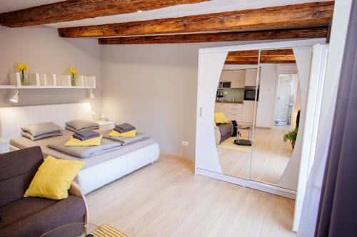 een slaapkamer met een bed en een grote spiegel bij Apartment 63 - 2 in Zagreb