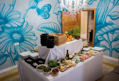 a table with food on it in a room at Valletta Lucente Guest House in Valletta
