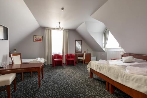 Postel nebo postele na pokoji v ubytování Hotel Skalite Spa & Wellness
