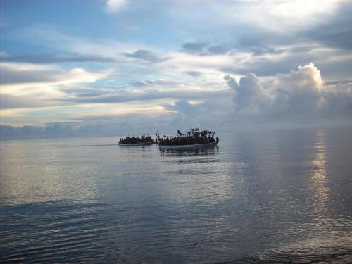 a group of people on a boat in the water at Gazelle International Hotel in Kokopo