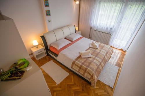 Кровать или кровати в номере Apartman Ružica