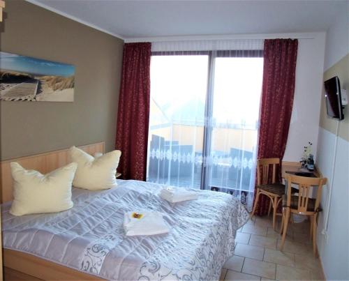 Postel nebo postele na pokoji v ubytování Hotel Bergmühle