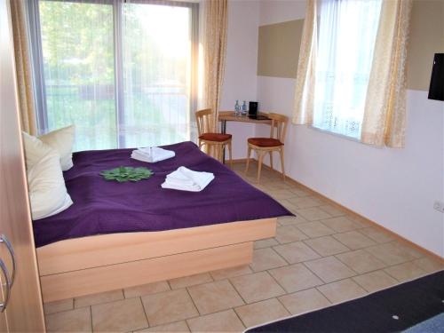 Postel nebo postele na pokoji v ubytování Hotel Bergmühle
