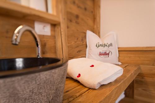 a towel sitting on a counter next to a sink at Landhof in Monguelfo