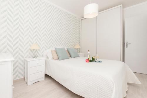 Llit o llits en una habitació de Ericeira T2 Navegantes Apartment