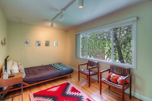 A seating area at Downtown Cottage in the Woods