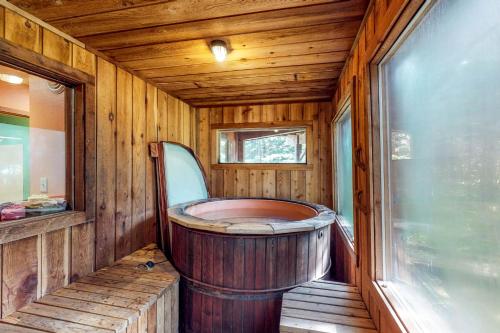 a wooden bathroom with a wooden tub in a room at Compton's in Girdwood