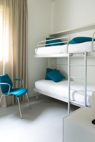 Postel nebo postele na pokoji v ubytování Filario Hotel & Residences