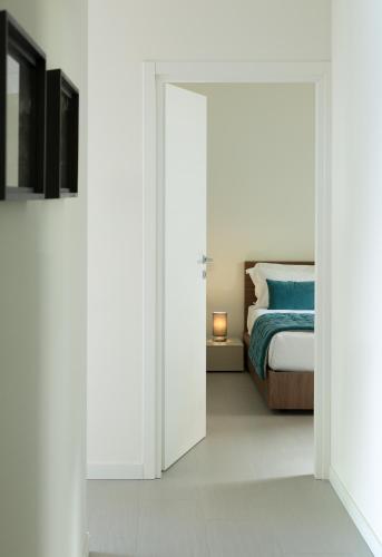 Postel nebo postele na pokoji v ubytování Filario Hotel & Residences