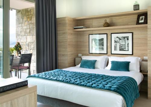 Postel nebo postele na pokoji v ubytování Filario Hotel & Residences