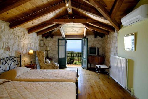 Ліжко або ліжка в номері Aresti Mountain Resort