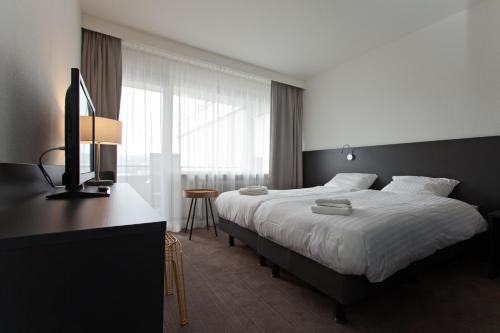 Postel nebo postele na pokoji v ubytování Hotel AM Fang