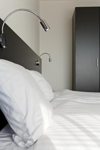 Ένα ή περισσότερα κρεβάτια σε δωμάτιο στο Hotel AM Fang