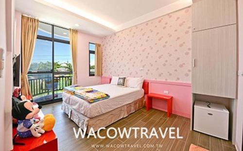 Postel nebo postele na pokoji v ubytování Mann Liuqiu Homestay