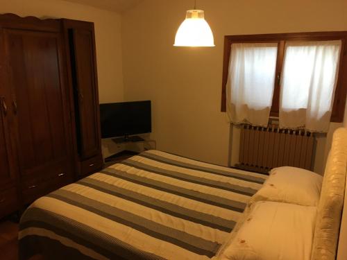 Cama o camas de una habitación en Casa Bellodi