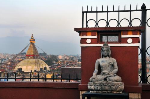 a statue sitting on top of a building at Hotel Tibet International in Kathmandu
