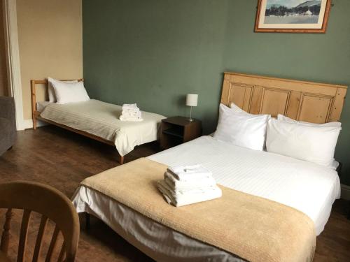 
A bed or beds in a room at The Od Inn
