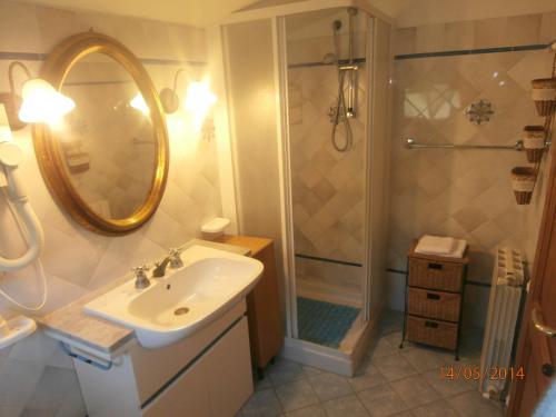 a bathroom with a sink and a shower at Villatramontistella in Capoliveri