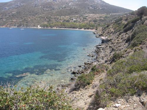a view of the beach from the side of a mountain at Boutique Hotel Tilos Mare in Livadia