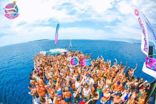 a group of people standing on a boat in the ocean at Villa Gaj in Novalja