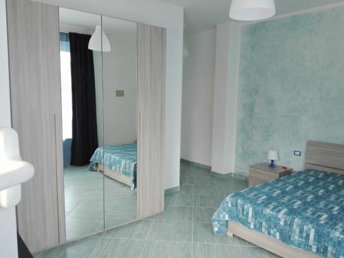Ένα ή περισσότερα κρεβάτια σε δωμάτιο στο Affittacamere Villa Zelinda
