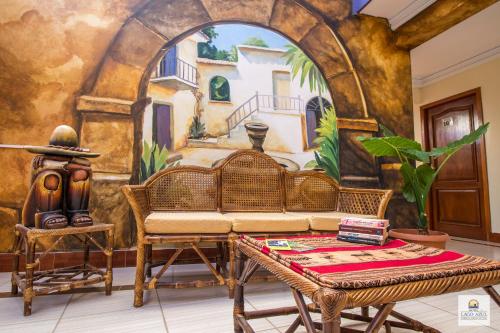 a room with a couch and a wall mural at Hotel Lago Azul in Copacabana