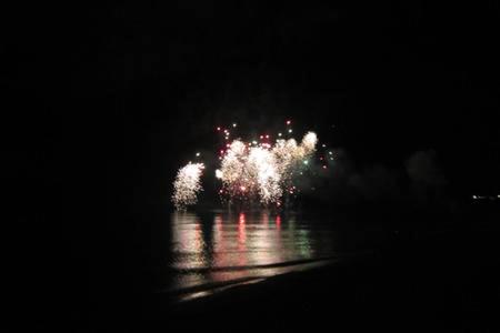 a firework display in the water at night at Ambra di mare in SantʼAgata di Militello