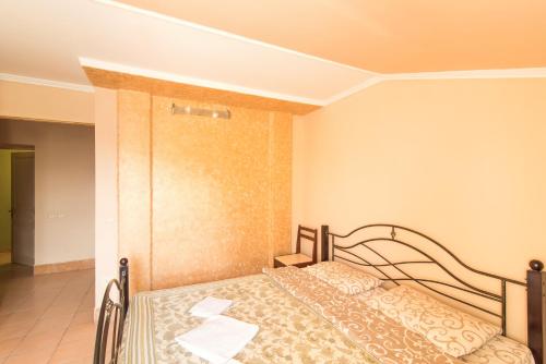 a bedroom with a bed in a room at Inter Hotel in Ternopilʼ