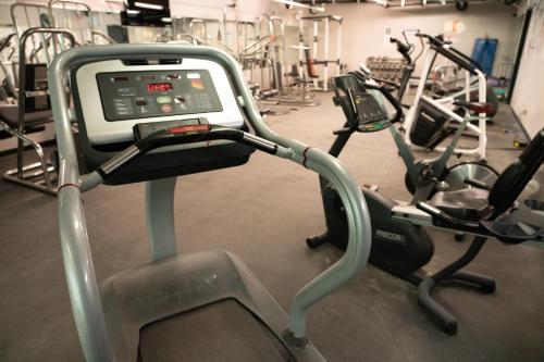 a gym with several exercise bikes in a room at Banff Rocky Mountain Resort in Banff