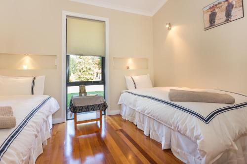 A bed or beds in a room at Cradle at Casa Blanca Country Retreat