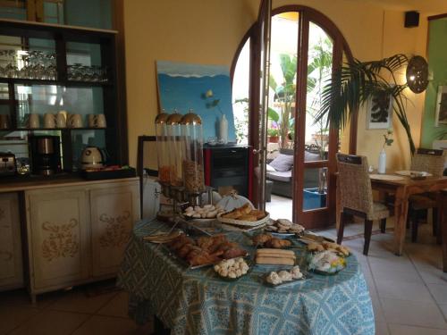 a table with bread and other food on it at Villa Madau in Pula