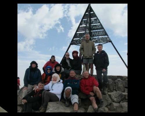a group of people posing in front of a pyramid at Gîte Atlas Mazik in Imlil