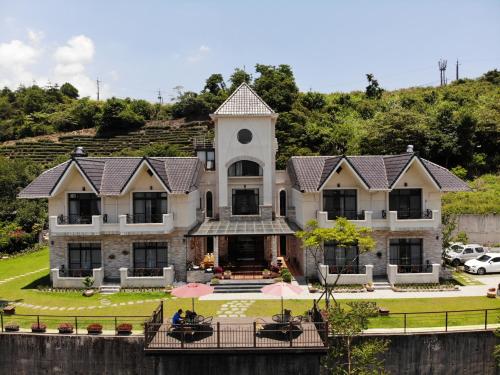a large building with a clock tower on top of it at Black Chimney in Datong