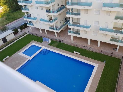 an overhead view of an apartment building with a swimming pool at Apartamento playa Piles in Piles