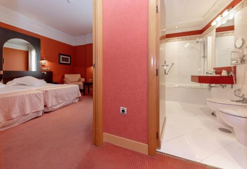 Un ou plusieurs lits dans un hébergement de l'établissement Hotel Soho Boutique Jerez