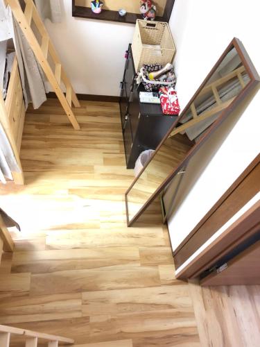 a staircase with wood flooring in a house at HISAYO'S INN in Tokyo