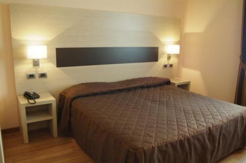 Postel nebo postele na pokoji v ubytování Hotel Arthur
