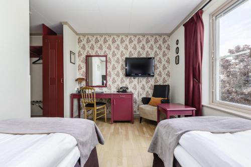 Postel nebo postele na pokoji v ubytování Såstaholm Hotell & Konferens