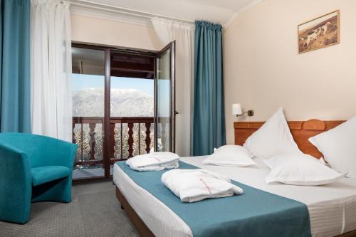 Postel nebo postele na pokoji v ubytování Hotel Rozmarin