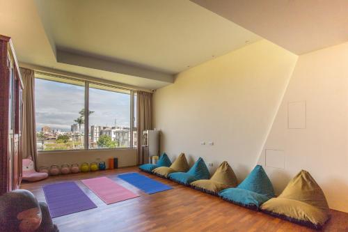 a living room with a couch with pillows on the floor at WMS Villa in Dongshan
