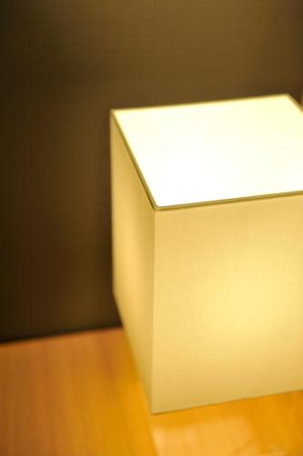 a white object sitting on top of a wooden table at FUGASTAY Shijo Omiya in Kyoto