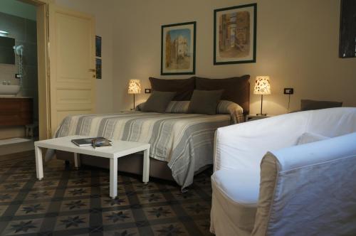 Un pat sau paturi într-o cameră la B&B Casa Laganà