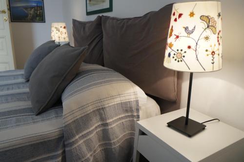 Postel nebo postele na pokoji v ubytování B&B Casa Laganà