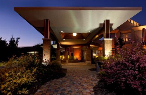 a building with a stone walkway in front of it at Hotel Sepia in Quebec City