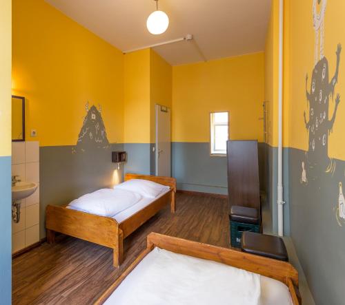 Un ou plusieurs lits dans un hébergement de l'établissement Sunflower Hostel Berlin